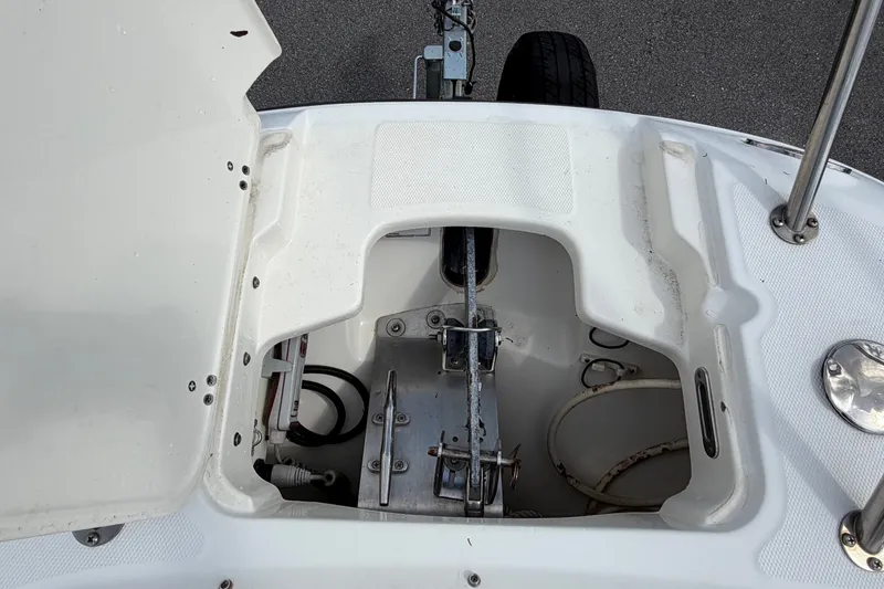 Slide: The Image of Open storage compartment of a 2015 Boston Whaler 270 Vantage boat, showing internal components. - 52