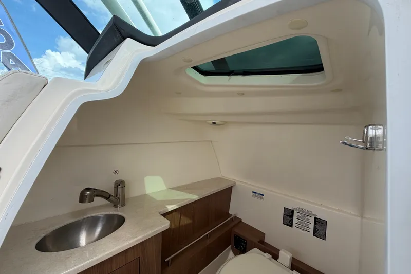 Slide: The Image of Interior of 2015 Boston Whaler 270 Vantage boat with sink and skylight. - 31