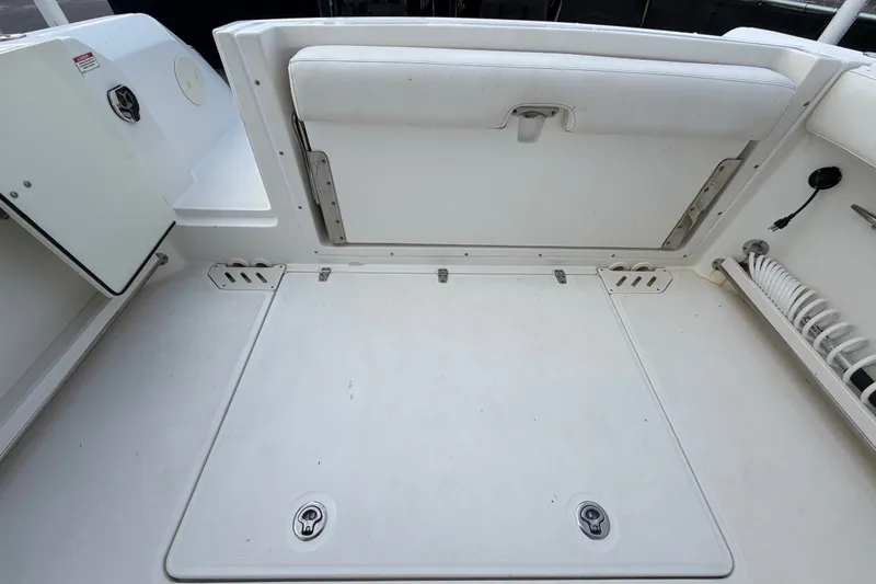 Slide: The Image of 2015 Boston Whaler 270 Vantage boat deck with storage compartments and seating. - 69