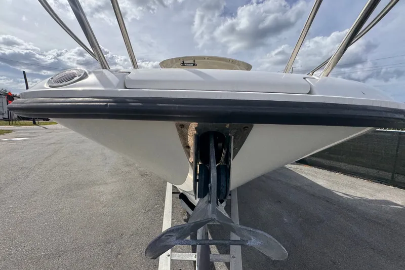Slide: The Image of 2015 Boston Whaler 270 Vantage boat, front view with anchor, under cloudy sky. - 15