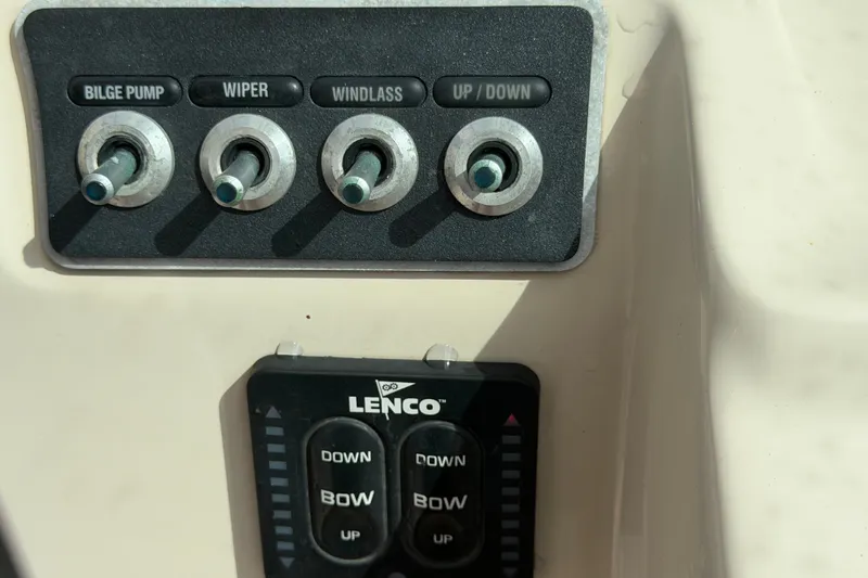 Slide: The Image of Control panel of a 2015 Boston Whaler 270 Vantage boat with switches and Lenco trim tab. - 41