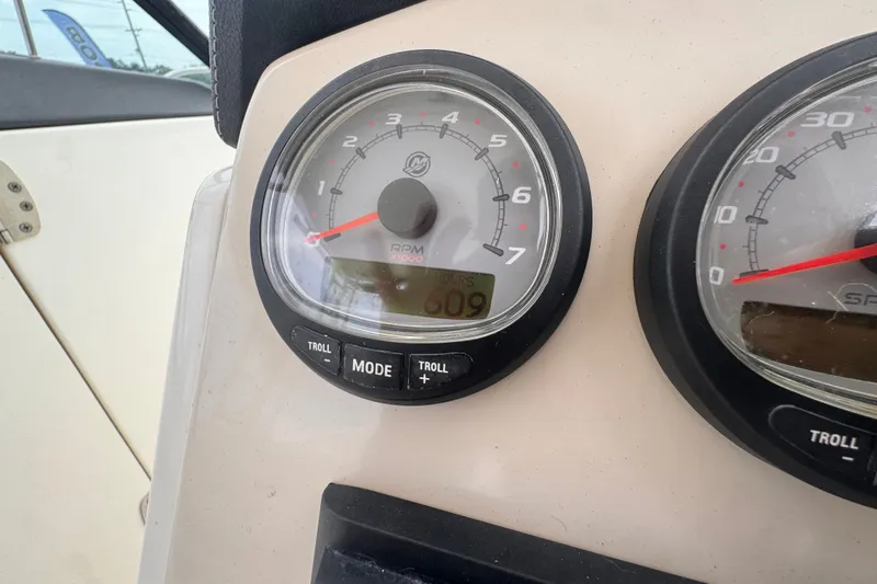 Slide: The Image of Close-up of 2015 Boston Whaler 270 Vantage boat dashboard gauges showing RPM and speed. - 121