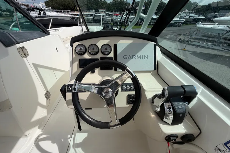 Slide: The Image of 2015 Boston Whaler 270 Vantage helm with Garmin navigation and modern controls. - 35