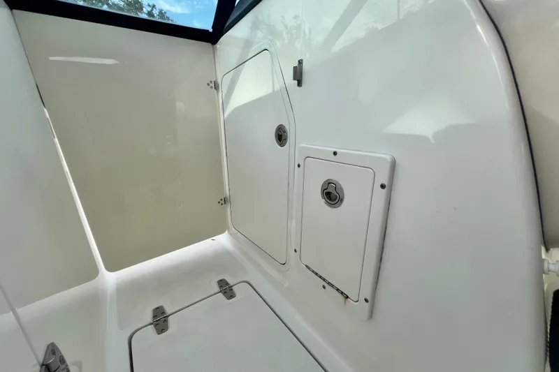 Slide: The Image of Interior view of a 2015 Boston Whaler 270 Vantage boat compartment. - 73