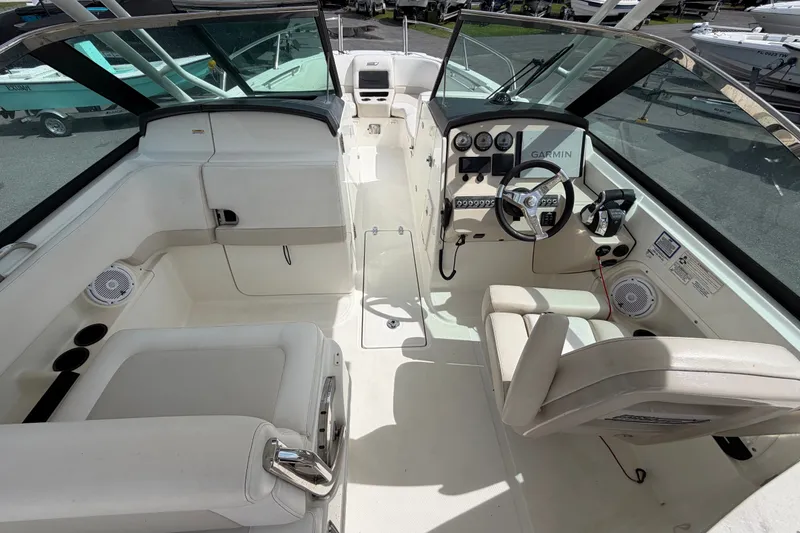 Slide: The Image of 2015 Boston Whaler 270 Vantage boat interior with steering wheel and seating. - 23