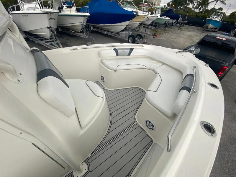 Slide: The Image of Century 2301 boat interior, 2015 model, featuring white cushioned seating and sleek design. - 30