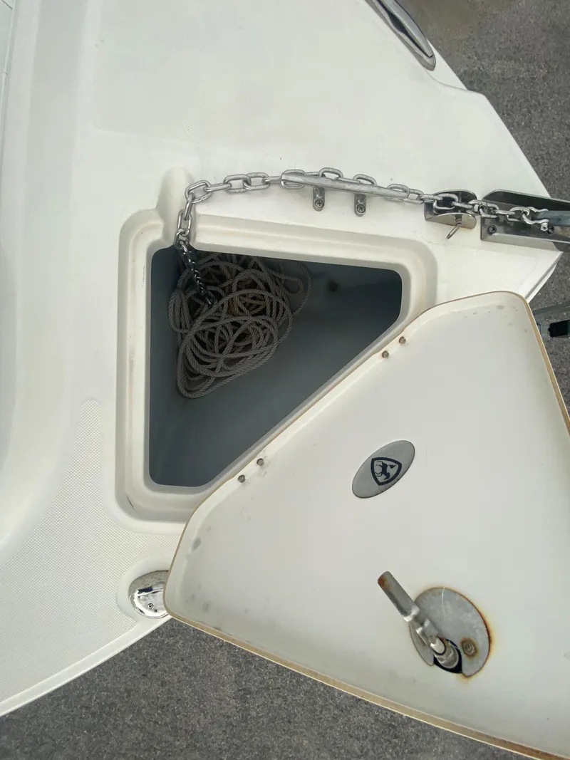Slide: The Image of Open anchor locker on 2015 Century 2301 boat with chain and rope inside. - 33
