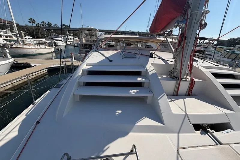 Slide: The Image of Sailboat deck view of 2000 Leopard 38 catamaran in marina setting. - 120