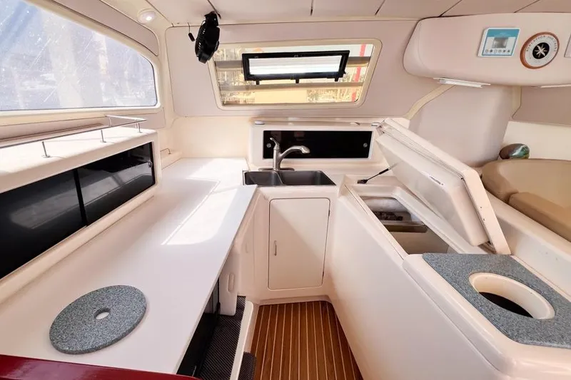 Slide: The Image of Interior of a 2000 Leopard 38 yacht kitchen with sink and storage. - 38