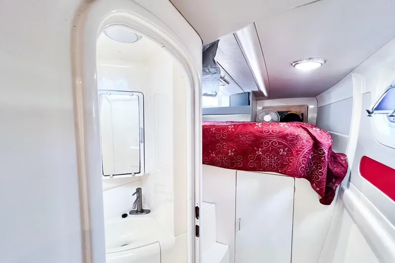 Slide: The Image of Interior of 2000 Leopard 38 yacht with compact bathroom and cozy cabin. - 78