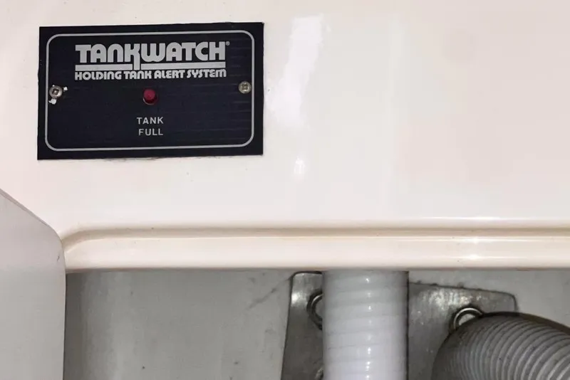 Slide: The Image of TankWatch holding tank alert system on Leopard 38, 2000 model, indicating tank full. - 58