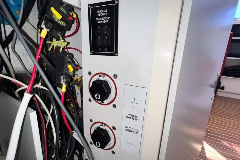 Slide: The Image of Electrical panel with windlass breaker and battery switches on a 2000 Leopard 38. - 85