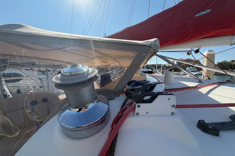 Slide: The Image of Sailing yacht deck with winch and red sail, Leopard 38, 2000 model. - 99