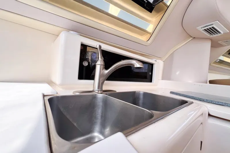 Slide: The Image of Stainless steel sink in a 2000 Leopard 38 yacht kitchen interior. - 39
