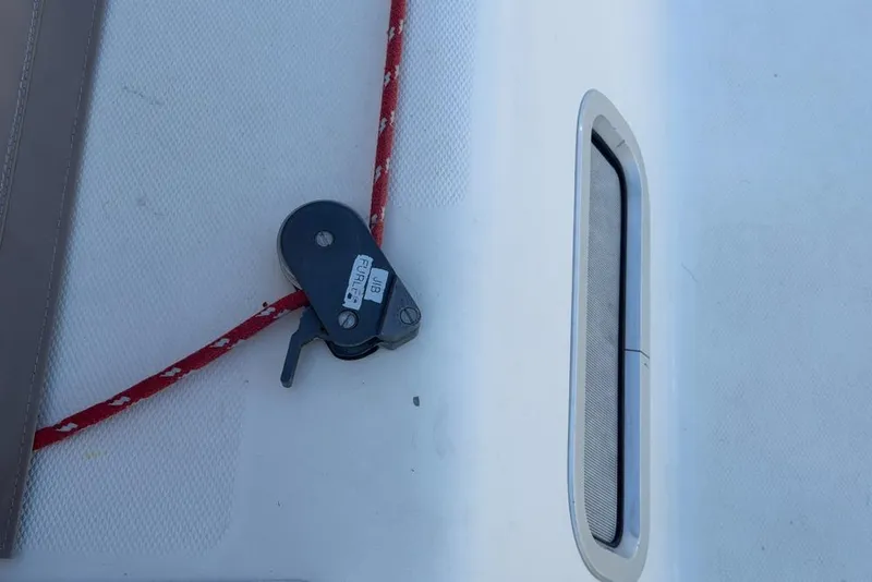 Slide: The Image of Deck of 2000 Leopard 38 with red rope and pulley system. - 96