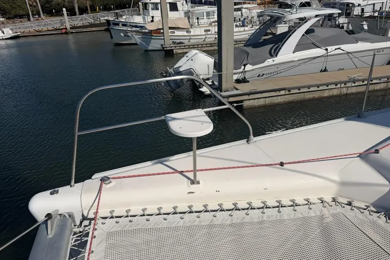 Slide: The Image of Catamaran Leopard 38, 2000 model, docked in marina with other boats. - 124