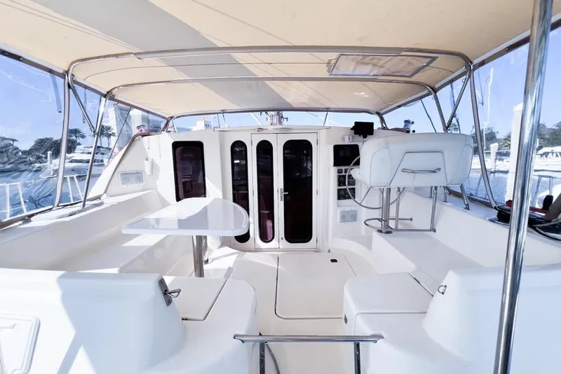 Slide: The Image of Spacious interior of a 2000 Leopard 38 catamaran with seating and helm station. - 20