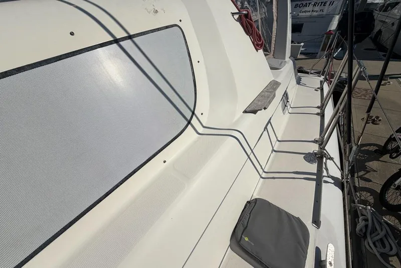 Slide: The Image of Deck of a 2000 Leopard 38 catamaran with railing and equipment. - 139