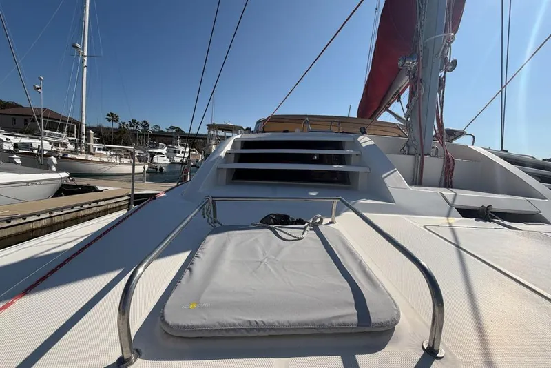Slide: The Image of Deck view of a 2000 Leopard 38 catamaran docked at a marina. - 104