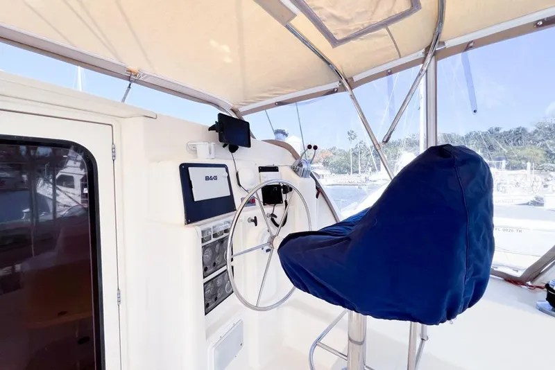 Slide: The Image of Helm station of 2000 Leopard 38 catamaran with covered seat and navigation equipment. - 26
