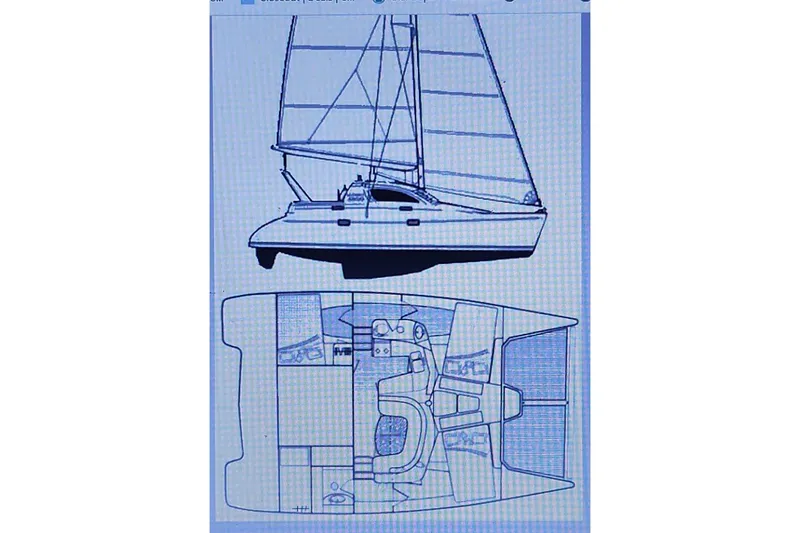 Slide: The Image of Blueprint of a 2000 Leopard 38 catamaran, showing side and top views. - 19