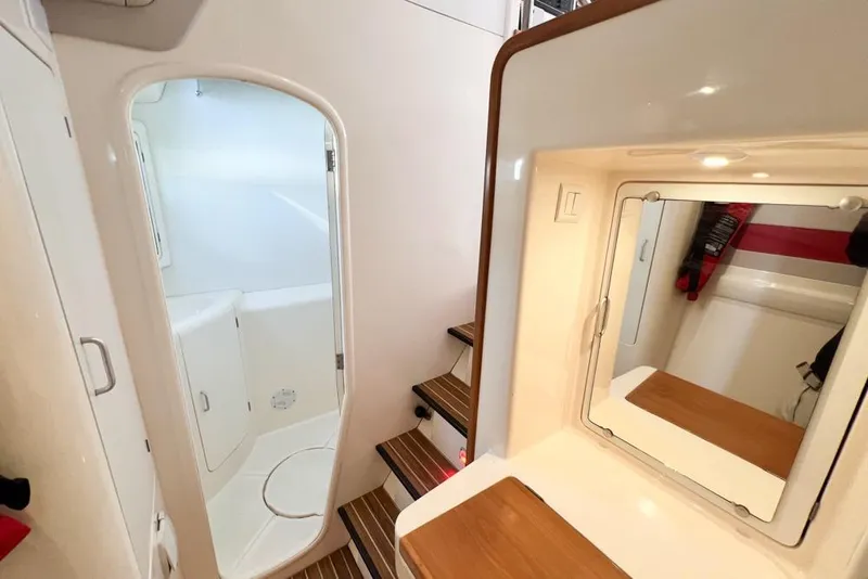 Slide: The Image of Interior of 2000 Leopard 38 yacht with bathroom and wooden steps. - 68