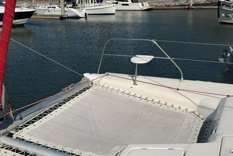Slide: The Image of Leopard 38 catamaran deck with netting, docked in a marina, 2000 model. - 129