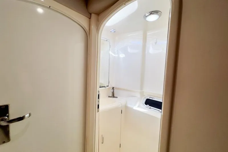 Slide: The Image of Bathroom interior of 2000 Leopard 38 yacht, featuring sleek design and modern fixtures. - 53