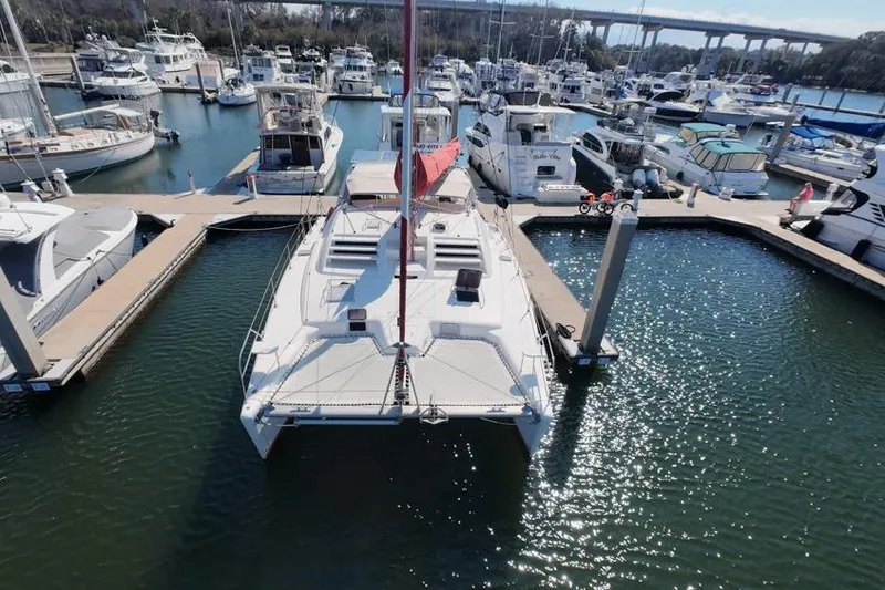 Slide: The Image of Aerial view of a 2000 Leopard 38 catamaran docked in a marina. - 16