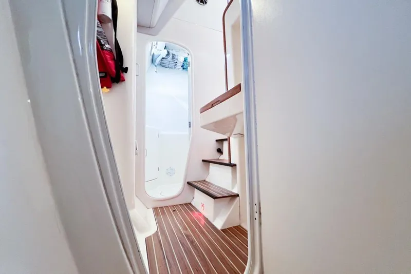 Slide: The Image of Interior of 2000 Leopard 38 yacht with wooden steps and modern design. - 82