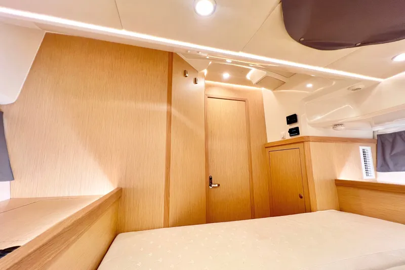 Slide: The Image of Interior of 2024 Skamander 100 Sorrento, featuring modern wood paneling and ambient lighting. - 196