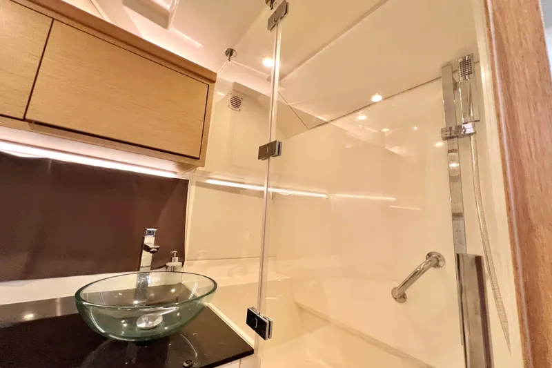 Slide: The Image of Modern bathroom interior in 2024 Skamander 100 Sorrento yacht, featuring glass sink and sleek shower. - 201