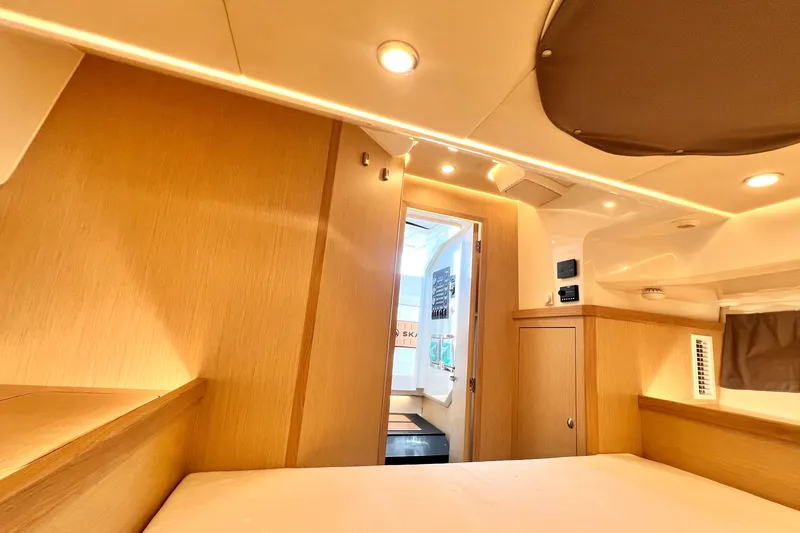 Slide: The Image of Luxurious interior of 2024 Skamander 100 Sorrento yacht, featuring modern wood finishes and ambient lighting. - 197