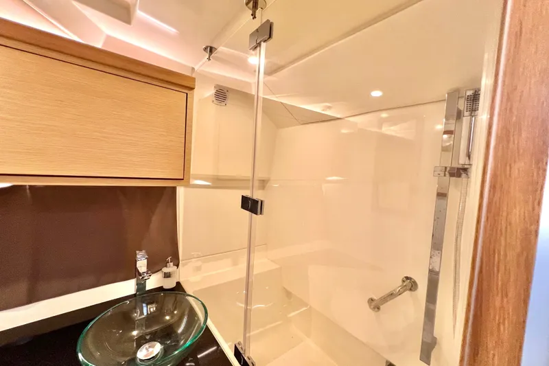 Slide: The Image of Luxurious bathroom interior of 2024 Skamander 100 Sorrento yacht with glass sink and shower. - 204