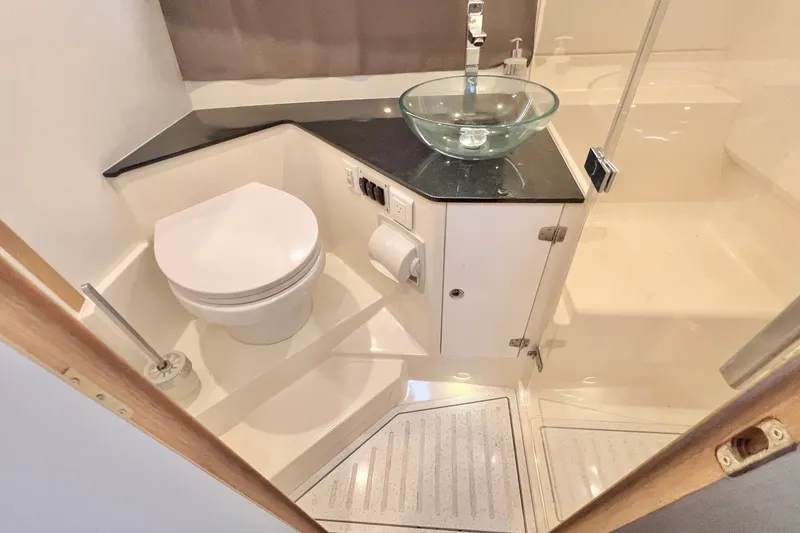 Slide: The Image of Modern bathroom in 2024 Skamander 100 Sorrento yacht with glass sink and toilet. - 203