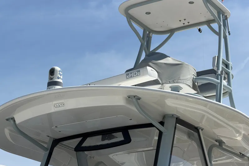 Slide: The Image of 2019 Regulator 41 boat with radar and navigation equipment under clear sky. - 7