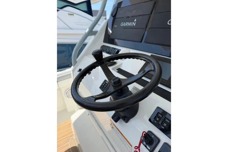 Slide: The Image of Steering wheel of 2019 Regulator 41 boat with Garmin navigation system. - 32