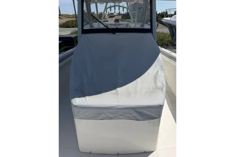 Slide: The Image of 2019 Regulator 41 boat with covered console, docked outdoors. - 38