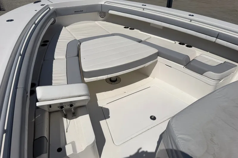 Slide: The Image of 2019 Regulator 41 boat interior with cushioned seating and spacious deck layout. - 37