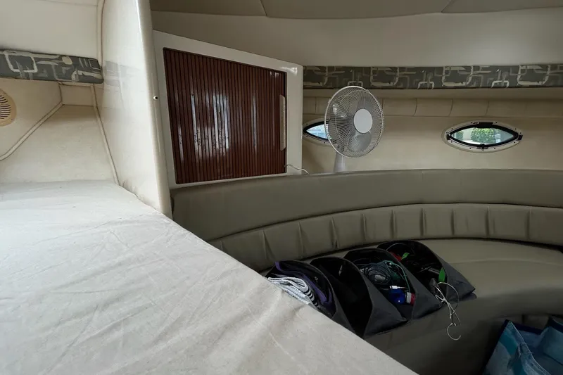 Slide: The Image of Interior of 2000 Monterey 330 Sport Yacht with seating, fan, and storage compartments. - 49
