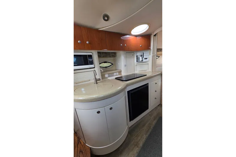 Slide: The Image of Interior of 2000 Monterey 330 Sport Yacht kitchen with modern appliances and sleek design. - 59
