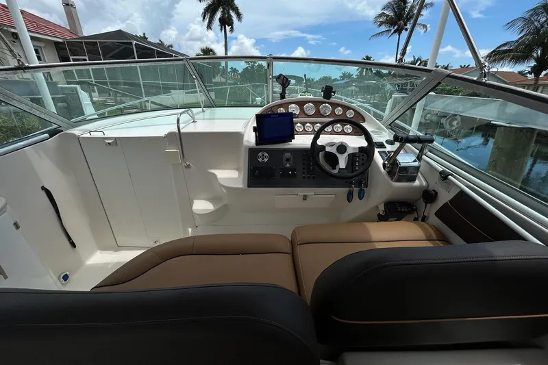Slide: The Image of Cockpit of 2000 Monterey 330 Sport Yacht with steering wheel and instrument panel. - 33