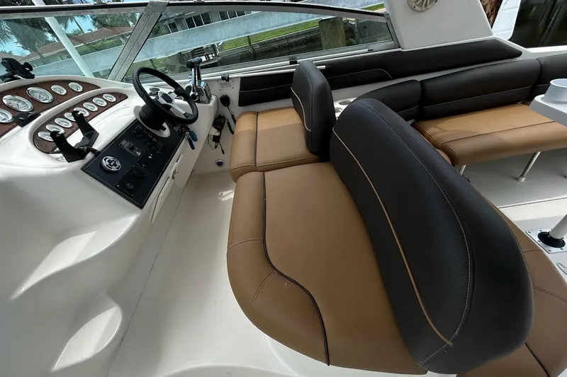 Slide: The Image of Interior of 2000 Monterey 330 Sport Yacht with brown and black seating. - 18