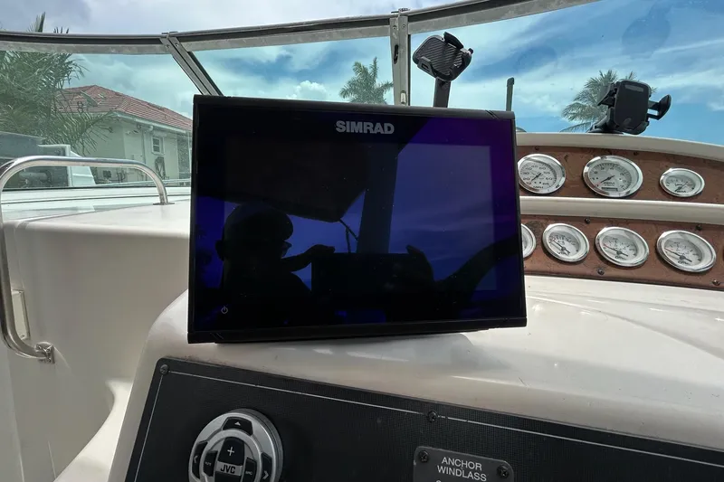 Slide: The Image of Dashboard of a 2000 Monterey 330 Sport Yacht with Simrad display and gauges. - 35