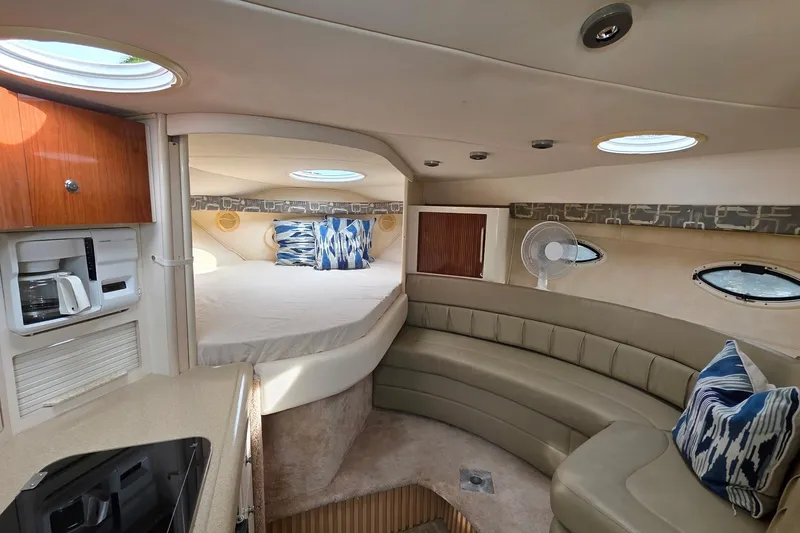 Slide: The Image of Interior of 2000 Monterey 330 Sport Yacht with cozy seating and bed area. - 56