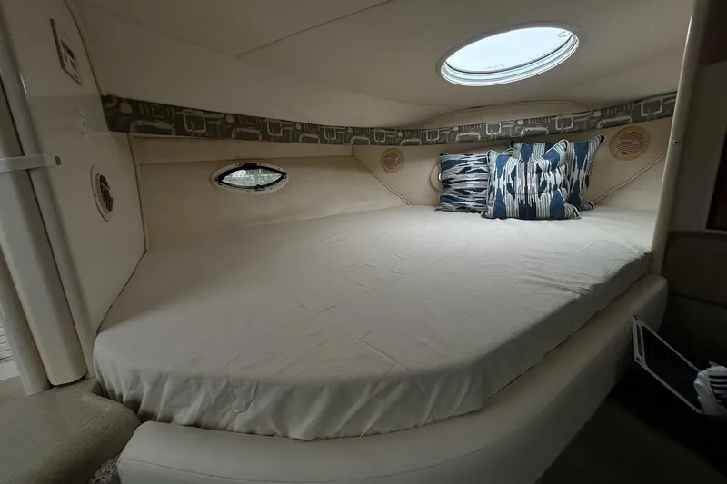 Slide: The Image of Cozy cabin interior of 2000 Monterey 330 Sport Yacht with plush bedding and decorative pillows. - 46