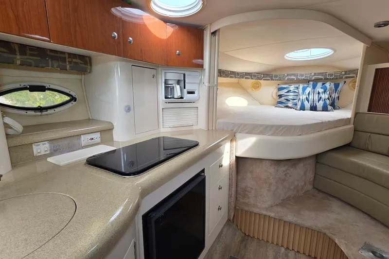Slide: The Image of Interior of 2000 Monterey 330 Sport Yacht with kitchenette and cozy sleeping area. - 57