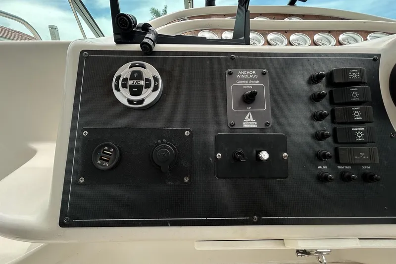 Slide: The Image of Control panel of a 2000 Monterey 330 Sport Yacht with switches and USB ports. - 24