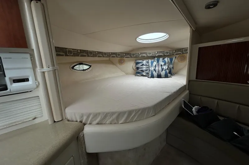 Slide: The Image of Cozy cabin interior of 2000 Monterey 330 Sport Yacht with bed and pillows. - 45