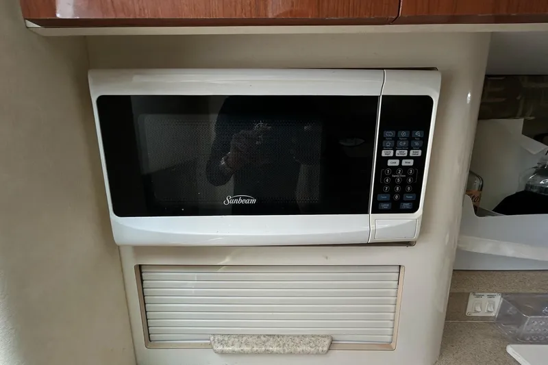 Slide: The Image of Sunbeam microwave in a 2000 Monterey 330 Sport Yacht kitchen area. - 40